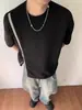 Camiseta estilo americano de manga corta diseñada para el verano, moderna tanto para hombres como para mujeres, top de manga corta con cremallera, corte holgado, colores contrastantes, cuello redondo