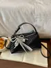 Bolso de mujer con patrón tejido transfronterizo, nuevo bolso de hombro cruzado de moda de nicho para otoño 2026, bolso de mano pequeño súper popular para salir