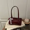 Bolsa de Nicho Francês para Mulheres Nova Transfronteiriça Bolsa Travesseiro com Laço Bolsa de Ombro Único Transversal Bolsa Baguete Portátil Bolsa de Comércio Exterior