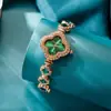 Liga viva de quatro folhas trevo moda pulseira decorativa relógio de quartzo esmeralda relógio feminino relógio mulheres fabricantes de relógios atacado