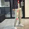 Marca Europea y Americana de Moda de Calle Pantalones de Mezclilla Largos Sueltos Rasgados con Parches Coloridos Desgastados para Hombre Verano 2025 Nuevo de Moda