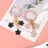 Novo Pingente Chaveiro de Metal Sakura Menina Simples Coração Flor Decoração de Celular Acessórios Pingente de Bolsa Venda por Atacado