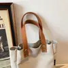 Bolsa de lona casual bordada con dibujos animados para mujer, nuevo estilo 2026, gran capacidad, adecuada para estudiantes, para ir al trabajo y versátil para el uso diario como bolso de hombro o bolso de mano