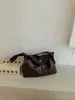 Bolso de mano de moda transfronterizo para mujer, nueva colección 2026, con un diseño retro de alta gama, adecuado para ir al trabajo, y se puede llevar como bolso de hombro o bolso cruzado