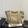 Nuevo bolso de lona de color liso para principios de otoño de 2026, bolso de hombro grande de alta capacidad para mujer, bolso tote, bolso de mano, bolsos de mujer al por mayor