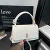 Bolso Cruzado de Hombro Único Tejido de Color Sólido Exquisito Elegante de Nicho de Moda 2026 Nuevo Bolso de Mano Versátil Bolso para Viaje