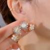 Pendientes de flor de ojo de gato de alta calidad con aguja de plata S925 para mujer, diseño de nicho de lujo ligero y combinable con todo.