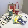 Funda para taza de té de leche portátil de dibujos animados de perro linda estilo Ins, bolsa de lona, funda aislante para taza de café anti-quemaduras al por mayor