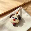 Encantador perrito peludo con la lengua fuera, llavero para bolso, colgante de dibujos animados natural, semillas de terapia de sonido curativas, popular en zonas escénicas, amuleto divertido y adorable