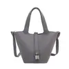 Bolso de mano pequeño con textura de comercio exterior, elegante, para mujer, nuevo popular 2026, bolso tote para debajo del brazo, bolso tipo cubo simple versátil