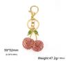 Comercio exterior exportación color aleación caliente colgante llave cereza lindo colgante niña caricatura regalo llavero