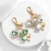 Llavero de Trébol de Cuatro Hojas con Pedrería Moda Europea y Americana Transfronteriza Colgante de Perla en Forma de Corazón Accesorios para Llavero de Bolso de Niña