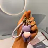 Chaveiro Ursinho de Pelúcia Coração Abraçando Fofo Borracha Macia Cola de Gotejamento Pingente para Bolsa de Mulher Pingente de Carro Barraca Pequeno Artigo