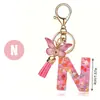 Llavero de moda con letras rosas, lentejuelas de amor, borla de mariposa, llavero, accesorios de colgante de epoxi de cristal para damas