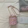 Bolso Cilíndrico con Lazo de Tablero de Ajedrez Fresco 2026 Nuevo Estilo Bolso Cruzado de Cadena Femenino Bolso de Hombro Casual Versátil