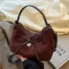 Bolso Retro de Ante tipo Dumpling Estilo Coreano Ins2026 Modelo Nuevo para Compras y Viajes, Bolso de Hombro Versátil con Lazo