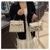 Bolsos estilo nuevo candado bolso Kelly, bolso de mano de moda europeo y americano con bloques de color para mujer, bolso cruzado de hombro texturizado y empalmado