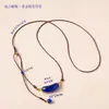 Colgante de tubo curvo de cristal natural, collar de verano colorido con un sentido de ambiente, cadena para clavícula de perla de agua dulce, cadena para suéter al por mayor