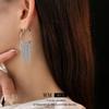 Pendientes de metal con hebilla de borla redonda galvanizada en oro real, estilo frío, pendientes personalizados de moda europea y americana para mujer, venta al por mayor