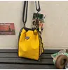Bolso cruzado distintivo de marca popular, con cordón, versátil, para teléfono móvil, bolso tipo cubo deportivo ligero, bolso de hombro casual