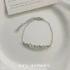 Pulsera de Forma Irregular con Tachuelas de Diamante para Mujer 2026 Modelo Nuevo Lujo Ligero Diseño de Nicho Joyería de Estilo Minimalista Único de Alta Gama