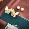 Pendientes de Mariposa y Perla con Circonita Retro Estilo Francés, Elegantes y con Estilo, un Diseño de Pendiente Versátil de Dos Vías, Lujo Ligero, Joyería de Oreja Dulce y Versátil