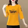 Camiseta de comercio exterior transfronterizo para madres de mediana edad y mayores, corte holgado, adelgazante, que cubre la barriga, manga tres cuartos