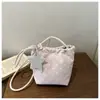 Bolso de cubo de alta gama fresco y dulce con cordón para mujer, nuevo estilo 2026, moderno, versátil, bandolera única, para ir al trabajo, bolso cruzado