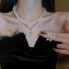 Collar de perlas con lazo de diamantes exagerados de estilo europeo y americano, elegante cadena de clavícula de nicho, joyería ligera de lujo de alta gama para mujer.