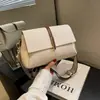 Bolso cruzado para mujer 2026 nuevo versátil para el trabajo bolsa cuadrada pequeña estilo coreano moderno diseño simple bolso de hombro bolso cruzado para mujer