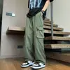 Pantalones cargo anchos de estilo retro para hombre, con bolsillos grandes, un diseño moderno y minimalista, colores lisos, un ajuste versátil y holgado, corte recto y cintura con cordón para uso casual.