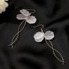 Corea del Sur pendientes largos de borla de pétalo eterno cara de hada super personalidad combinan con todo pendientes de moda de celebridad de internet E4918