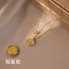 Collar de Acero de Titanio de Lujo Ligero con Piedra Ojo de Gato de Doble Cara para Mujer Modelo Nuevo 2026 Diseño de Nicho con Símbolo de la Fortuna Cadena para Clavícula Estilo Chino