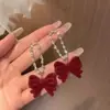 Brincos de Borla com Laço Vermelho 2026 Novo Estilo Quente Luxo Leve High-End Brincos de Ano Novo Acessórios de Orelha Únicos de Nicho