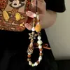Cadena para teléfono móvil KT de leopardo con combinación de colores Maillard casera original, cordón frío de cuentas DIY, colgante portátil para cámara ccd