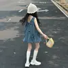 Conjunto para Meninas 2026 Novo Laço Infantil Médio e Grande Duas Peças Roupa Top Botão de Flor Saia Curta de Verão Meninas Tendência