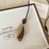 Nuevo Collar con Colgante de Estilo Étnico Chino para Mujer 2025 Nuevo Diseño de Nicho Cadena Larga para Suéter de Gama Alta