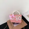 Nueva Versión Coreana Transfronteriza Bolso Infantil de Lazo Pequeño Estilo Chanel Camelia Bolso de Hombro Bolso de Mano con Perlas Versátil Bolso Cruzado