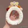 Faixa de cabeça de pelúcia divertida e peculiar para mulheres, com design de desenho animado, textura fofa e estilo de coroa alta, perfeita para lavar o rosto e adicionar um toque de sofisticação aos seus acessórios de cabelo.