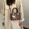 Bolso de mano casual para uso diario para mujer 2026 nuevo elegante de un solo hombro bandolera pequeño cuadrado estilo coreano ins temperamento"""