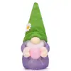 Muñeco de conejo de Pascua nuevo transfronterizo sosteniendo huevo de rábano de colores lindo muñeco de conejo decoración decoración del hogar