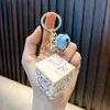 Woan coolomi llavero colgante cubo de Rubik al por mayor mini portátil cubo de Rubik colgante juguete educativo