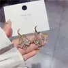 Exquisitos Aretes de Zirconia Rosa Brillante 2023 Nueva Moda Hebilla de Oreja de Amor Aretes de Lujo Ligero Aretes de Gama Alta