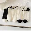 Calcetines de dibujos animados para mujer al por mayor, primavera y verano, transpirables, finos, lindos, versión coreana, versátiles, calcetines deportivos tipo barco, de boca baja y poco profunda