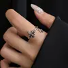 Anillo único vintage con flor de iris cruzada desgastada para mujer, nuevo anillo abierto versátil de alta gama retro totalmente pavonado con diamantes para mujer