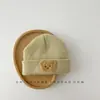 Chapéu infantil estilo coreano primavera e outono inverno fofo super fofo bebê tricô lã proteção de orelha pullover quente