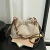 Versátil Bolso Pequeño de Lunares Plegado para Mujer 2026 Nuevo Bolso Cubo de Lona con Cordón Bolso de Hombro Cruzado Casual de Verano