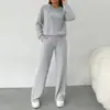 Conjunto casual cruzado de otoño nuevo para mujer, europeo y americano, 2026: sudadera con capucha holgada y pantalones largos, un conjunto de dos piezas para exportación