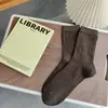 Calcetines estilo Meilad para mujer para otoño e invierno, con diseño de hilo de puntos, color liso, longitud hasta la mitad de la pantorrilla, versátiles, gris retro, tonos cálidos y estilo simple