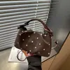 Bolsa de nube plisada de lunares estilo Ins coreano de alto valor para mujer 2026 nueva elegante y simple bandolera cruzada